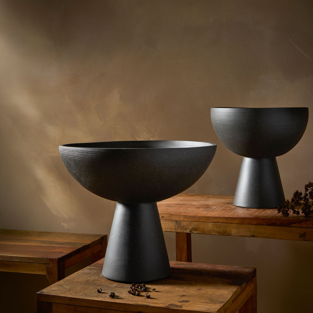 Florentina Footed Bowl in Black, styled in a room