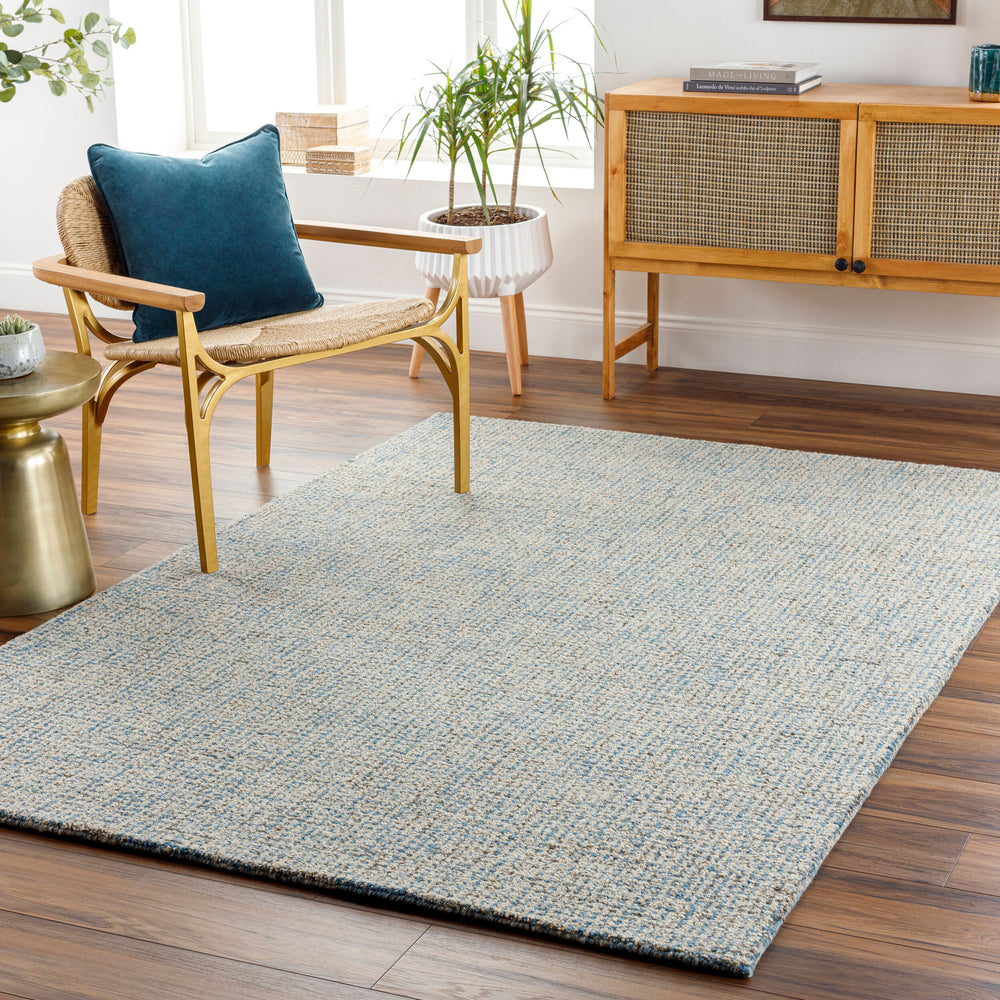 Aiden Hand Tufted Rug AEN-1001 in Blue, styled in a room