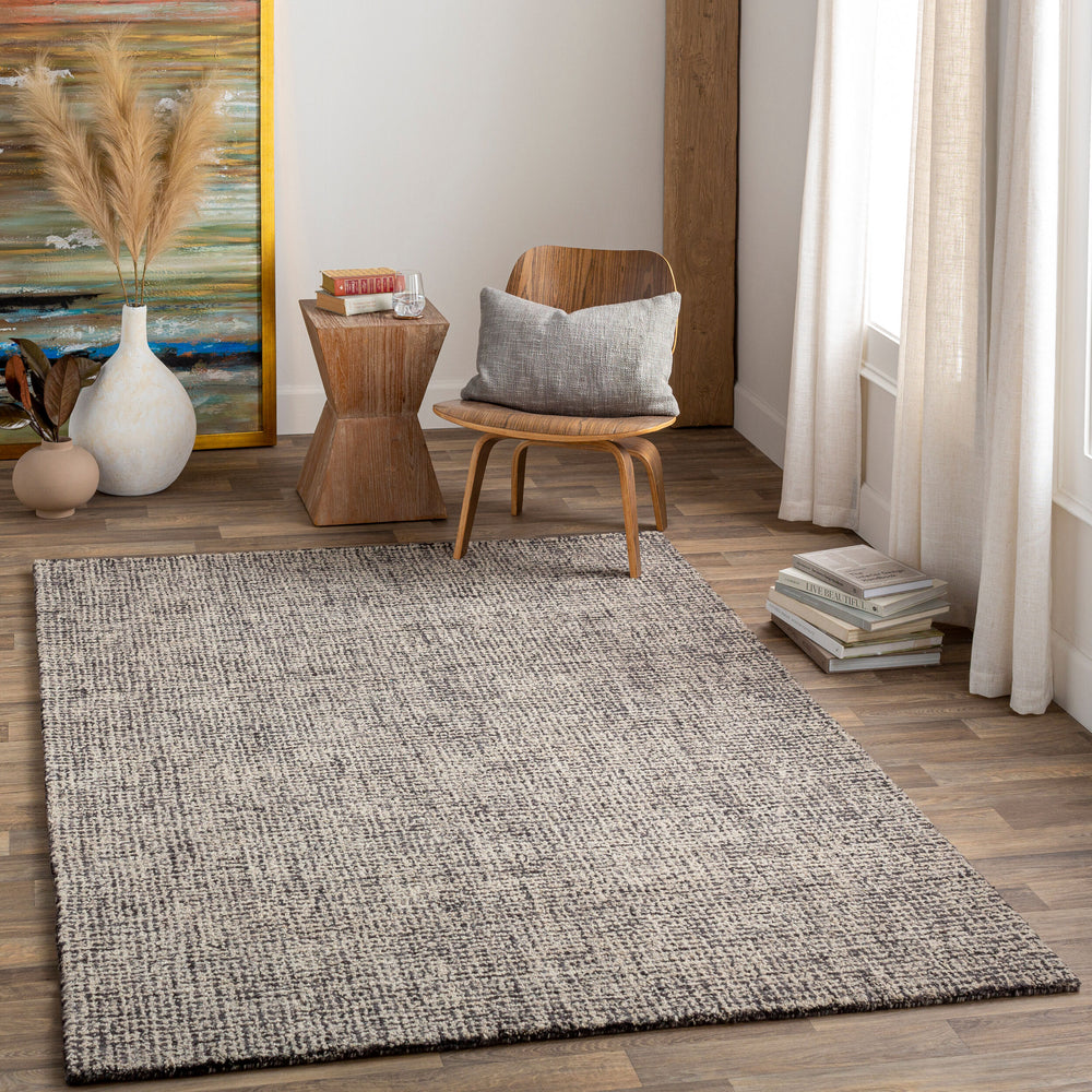 Aiden Hand Tufted Rug AEN-1002 in Ink Blue, styled in a room