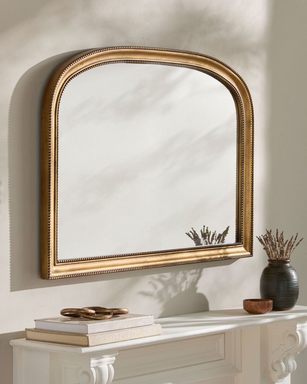 Nalanda Mantel Mirror ANAN-005 in Gold, styled in a room
