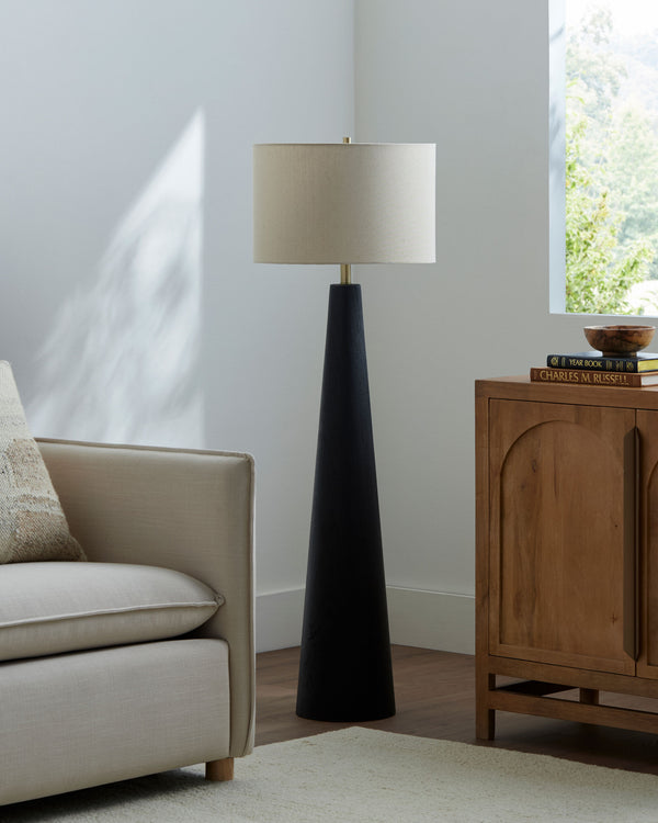 Baobab Accent Floor Lamp in black, styled in a room