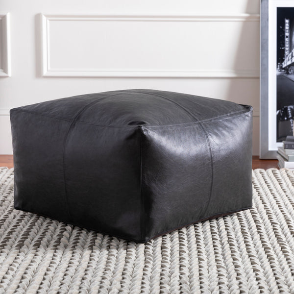Barrington Pouf in black, styled in a room
