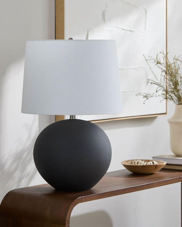 Chronos Accent Table Lamp in black, styled in a room