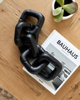 Sherman Decorative Sculpture EMH-006 in Black, styled in a room