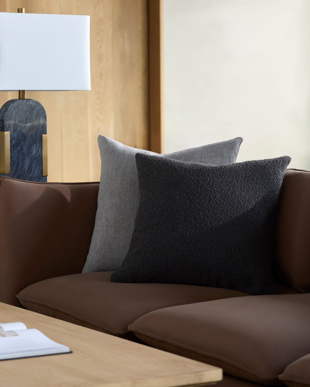 Eesha Accent Pillow ESH-006 in Black, styled in a room
