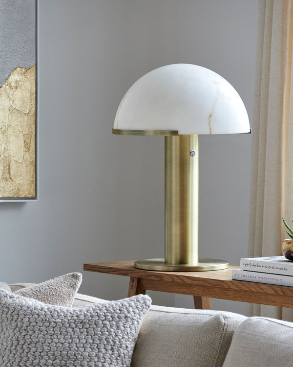Etoile Accent Table Lamp in brass, styled in a room