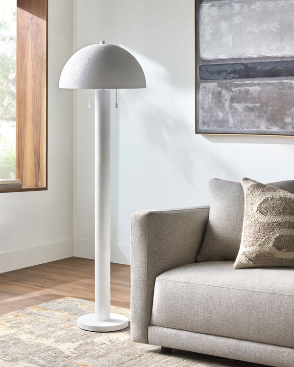 Hobro Accent Floor Lamp in white, styled in a room
