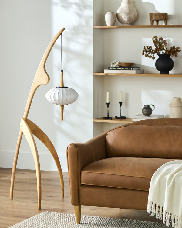 Niamey Accent Floor Lamp in cream, styled in a room