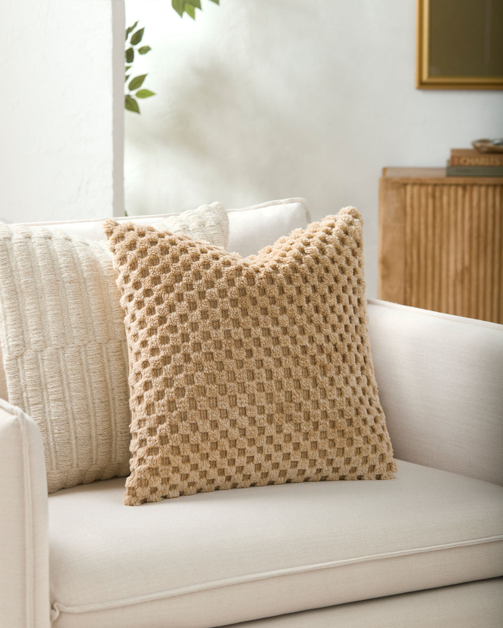 Novoli Accent Pillow NVO-001 in Taupe, styled in a room