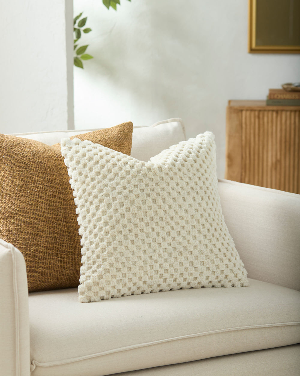 Novoli Accent Pillow NVO-002 in Eggshell, styled in a room