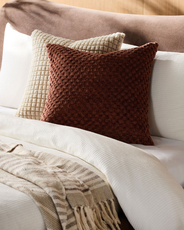 Novoli Accent Pillow NVO-003 in Chocolate, styled in a room