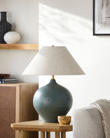 Pomarico Accent Table Lamp in green, styled in a room