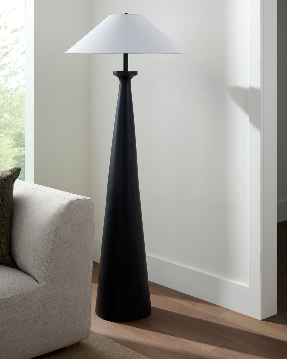 Virello Accent Floor Lamp, styled in a room